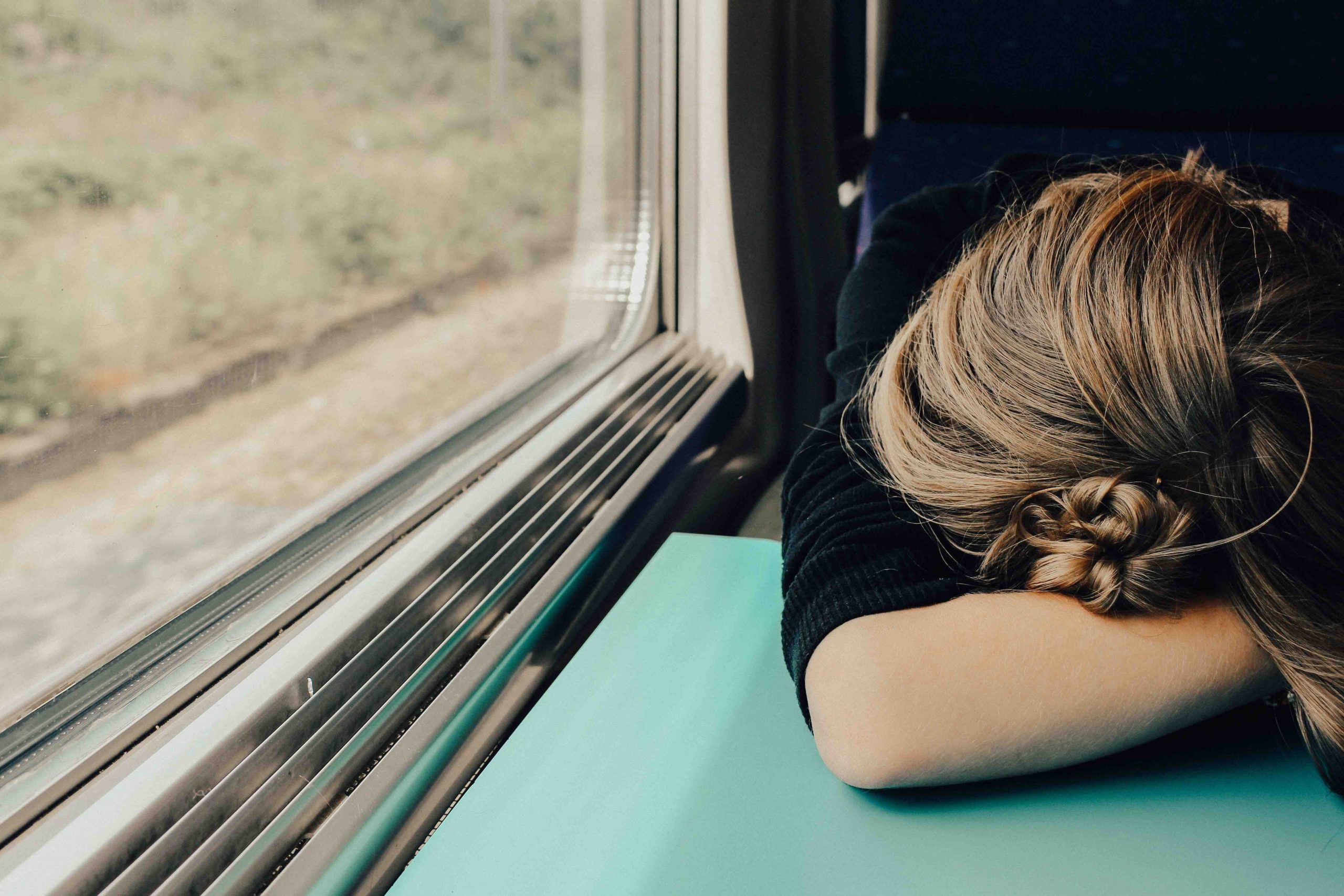 Girl head down on a table - Depression in Teenagers