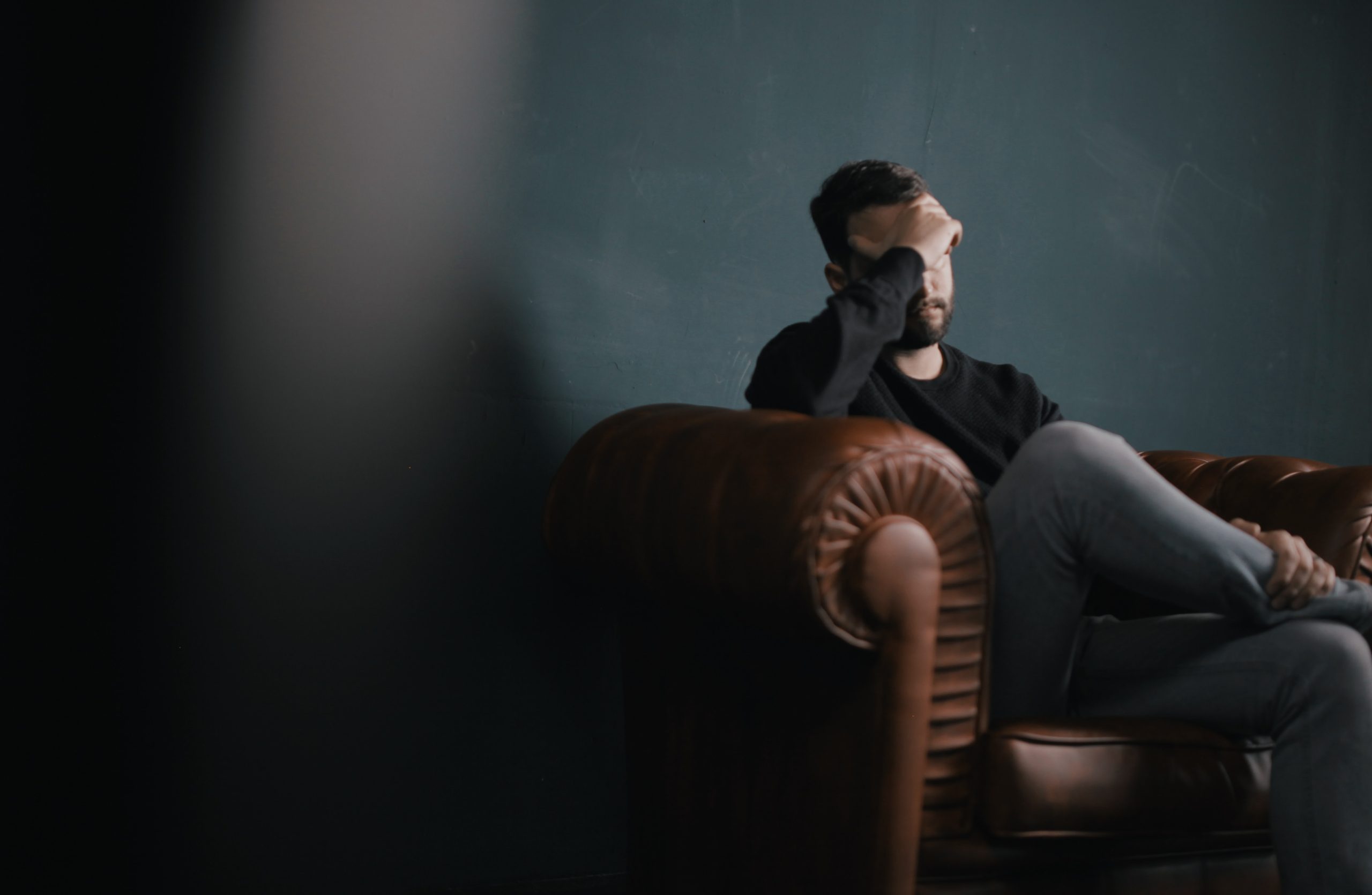 Sad disturbed man hold his head - Personality disorder