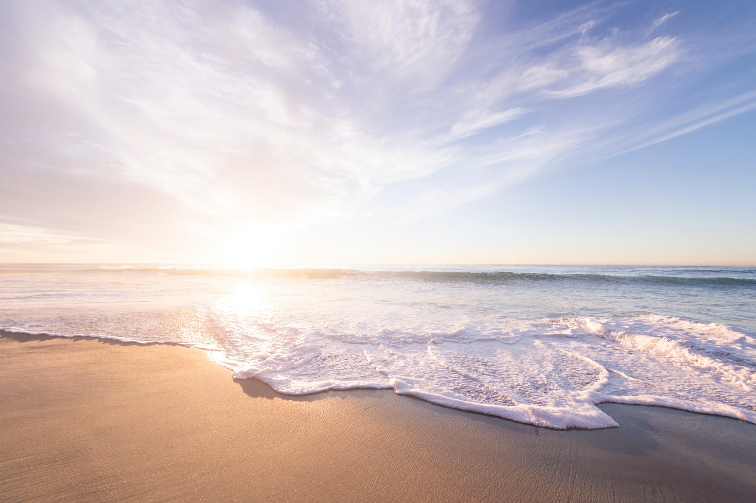 Serene view of an ocean - sand & beach waves