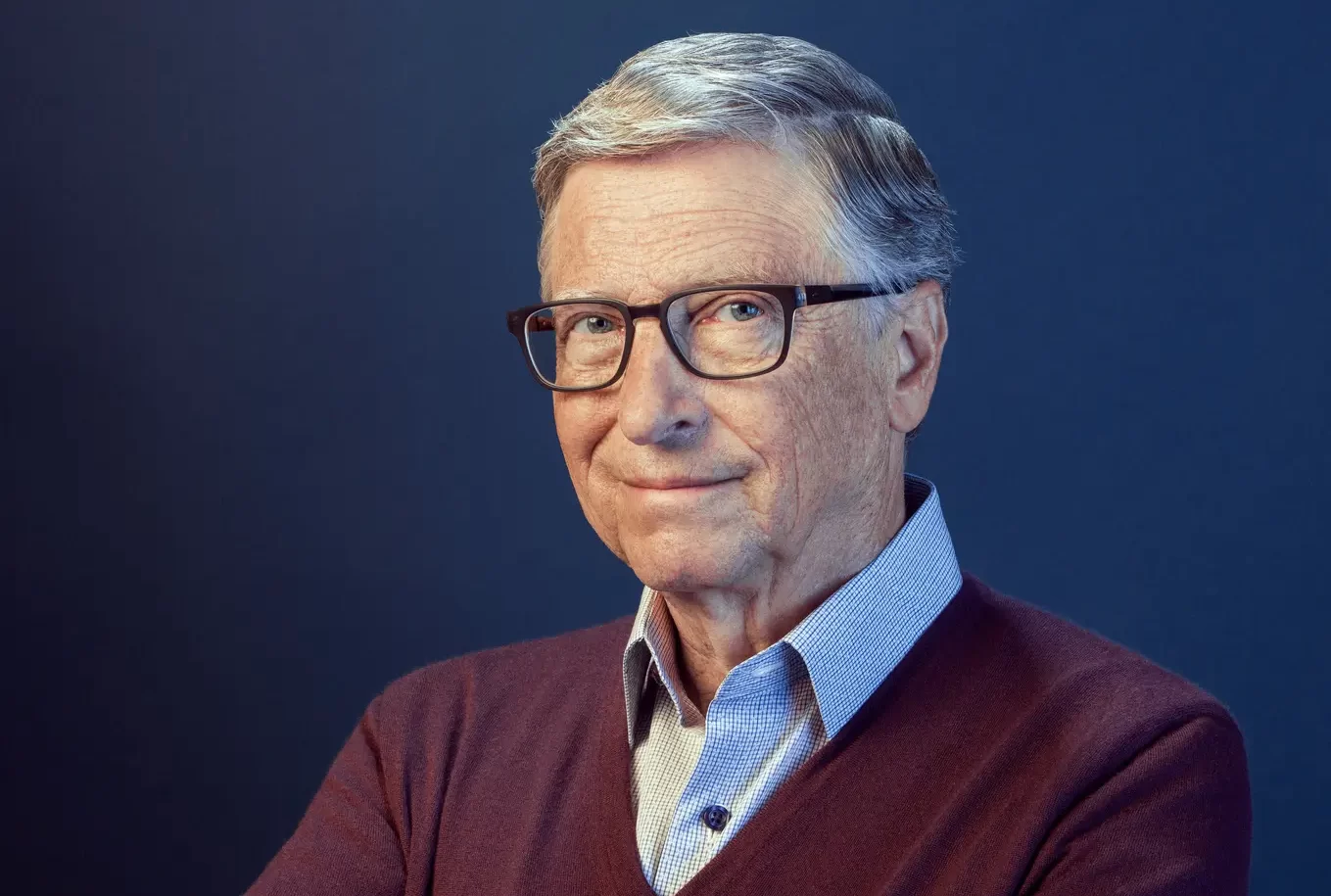 Bill Gates smiling cross armed