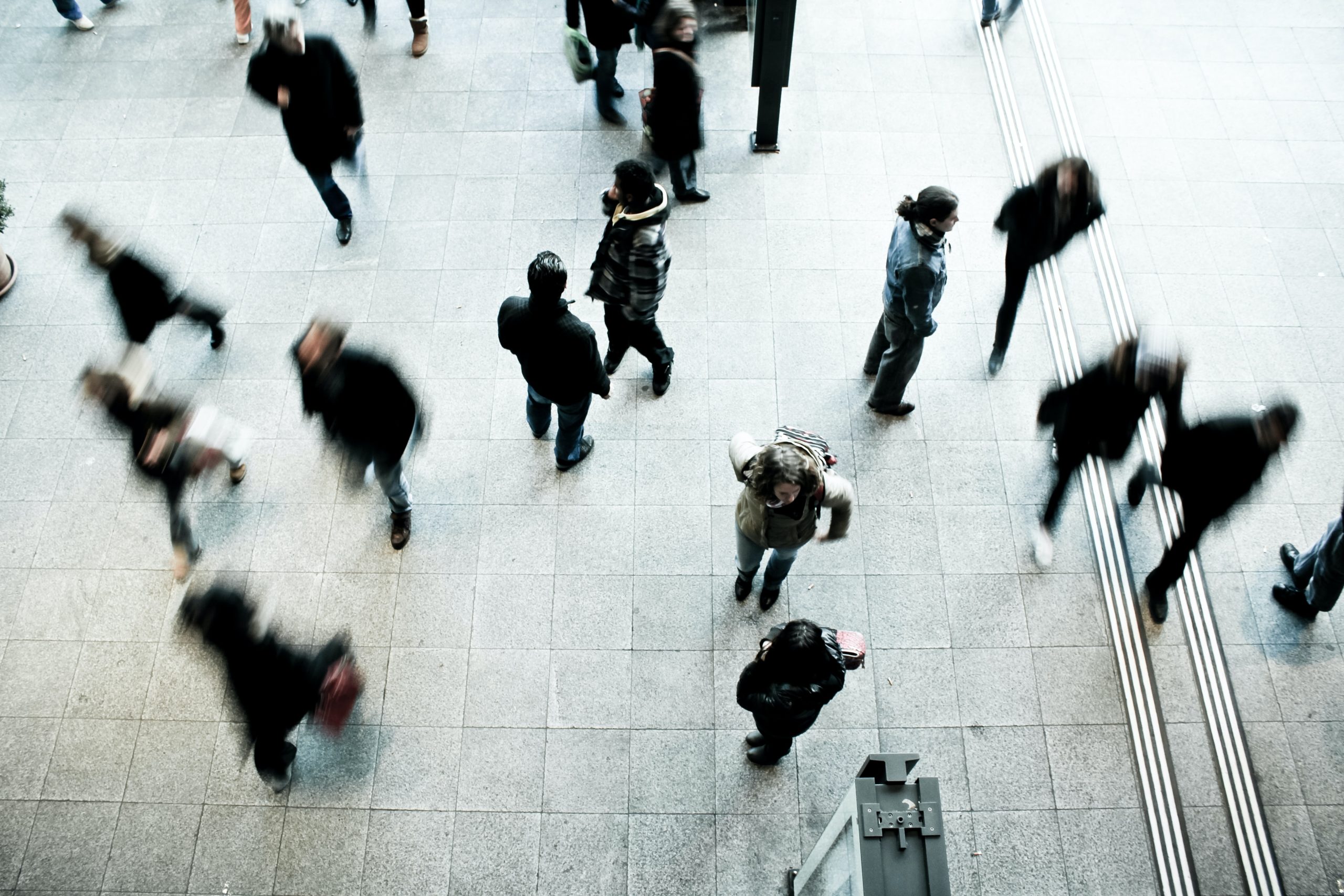 Blur image of moving people at train platform