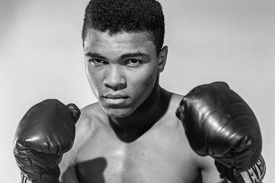 Black and white image of Muhammad ALi in boxing gloves