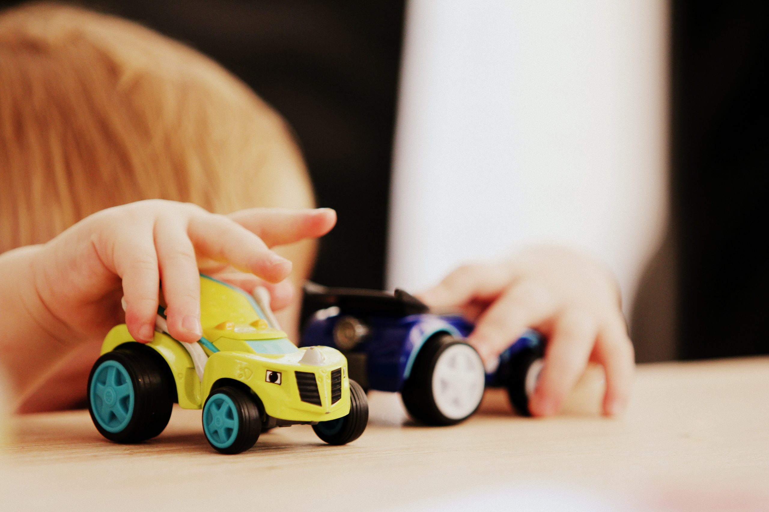 Kid playing with cars - Child with ADHD