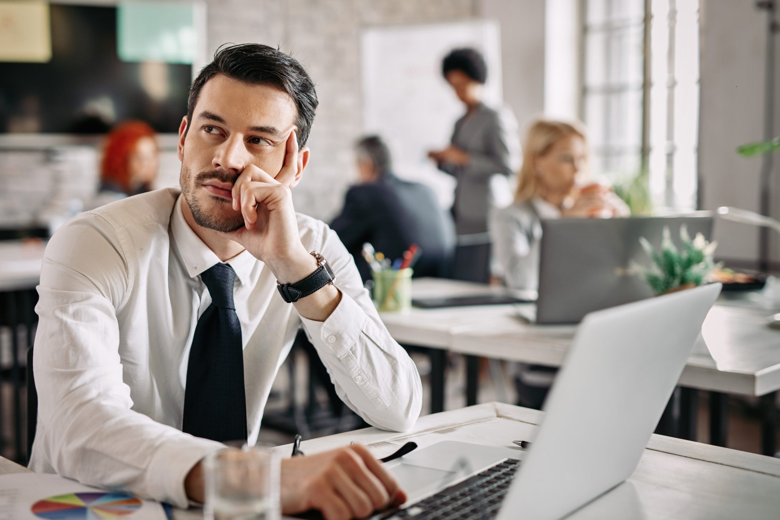 Employee Sitting in Office Thinking - Toxic Workplace Culture