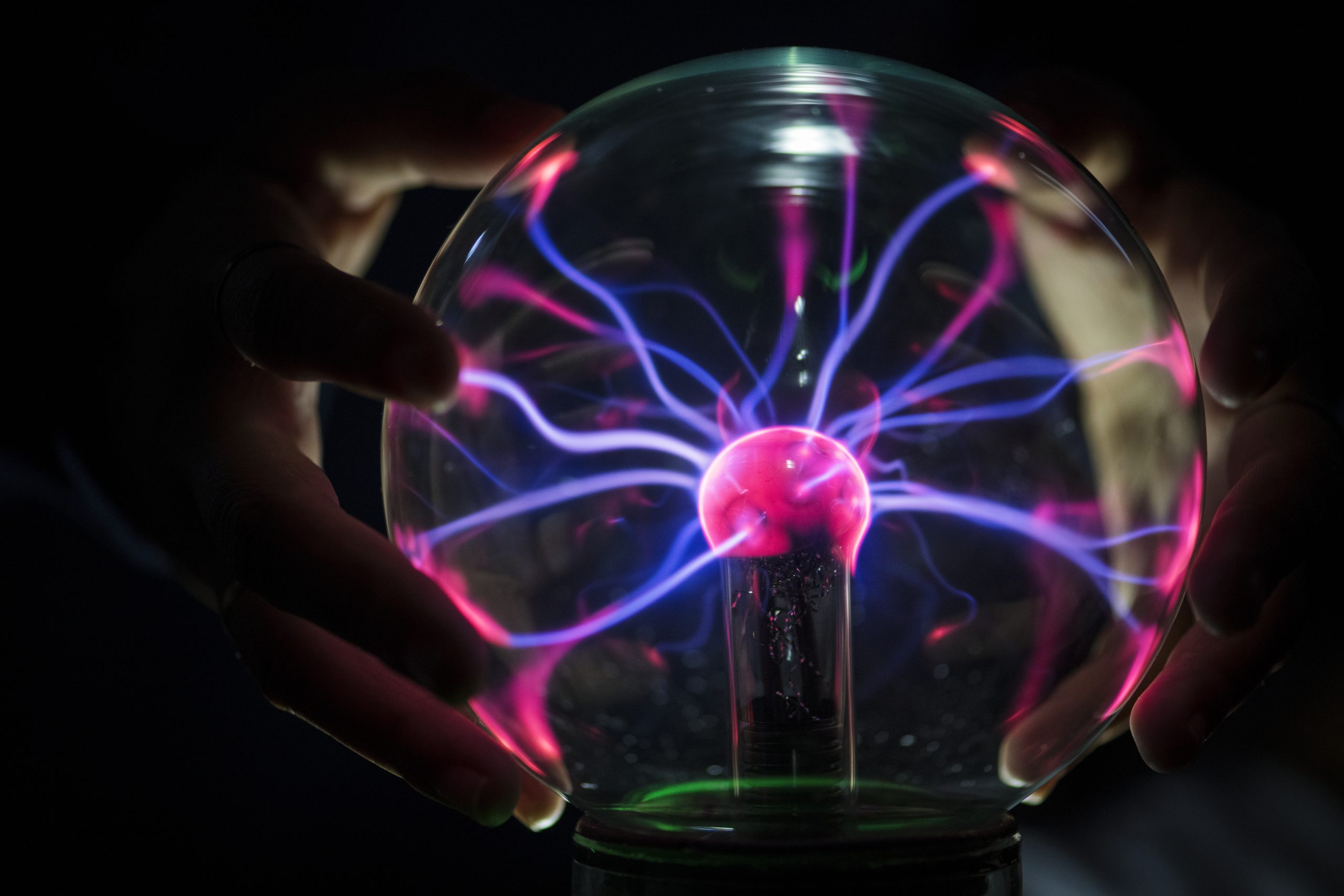 Closeup of a plasma globe in the darkness 