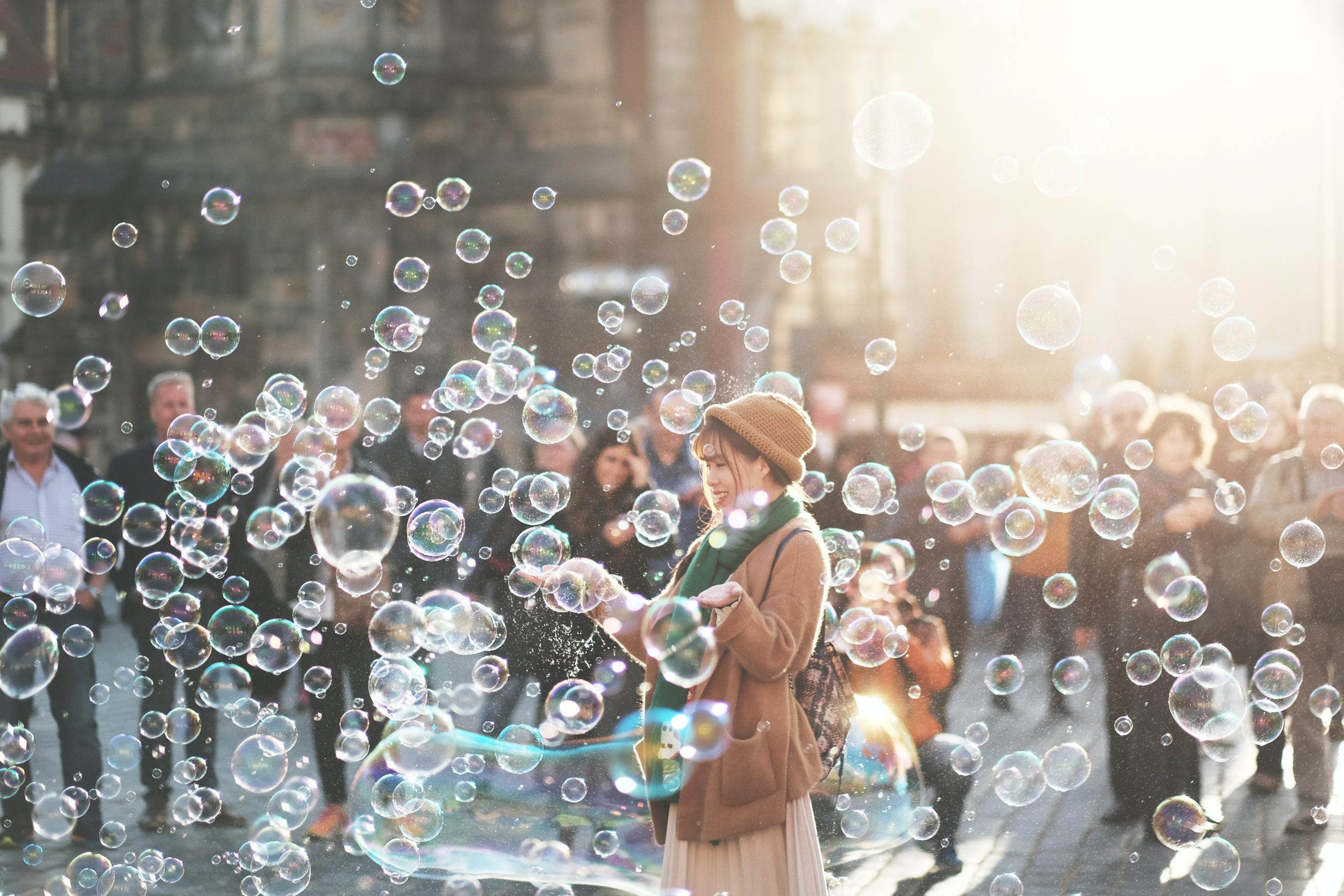 Woman playing with soap bubbles. 
