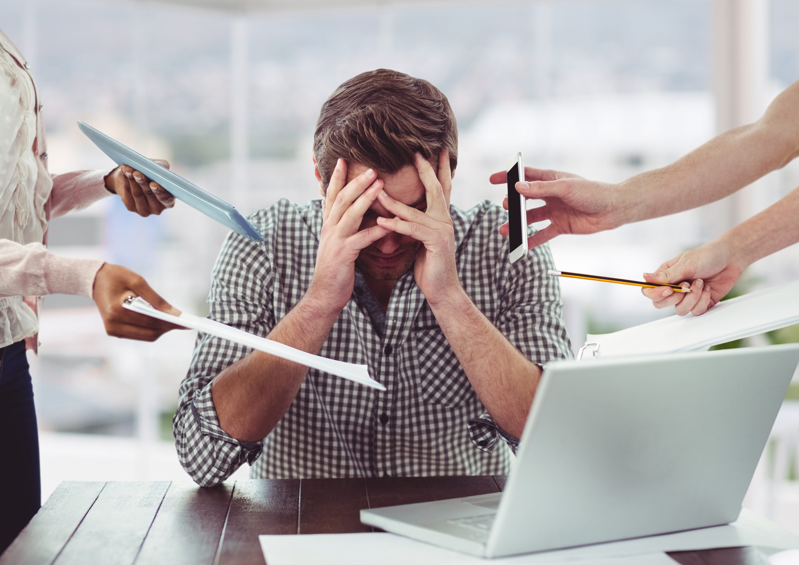 A man feeling burnout in the workplace