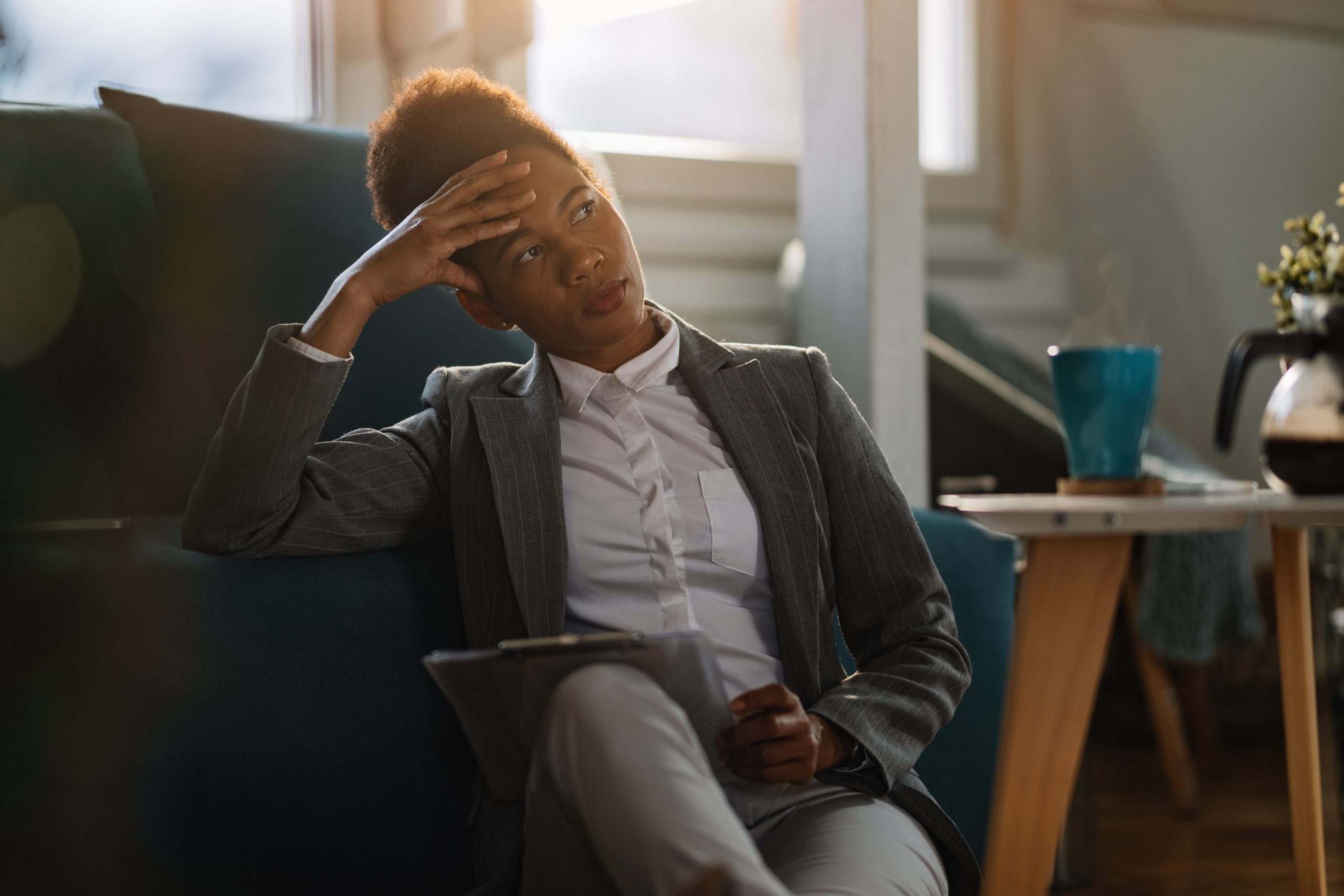 A woman deeply thinking about remedies to counter job loss issues