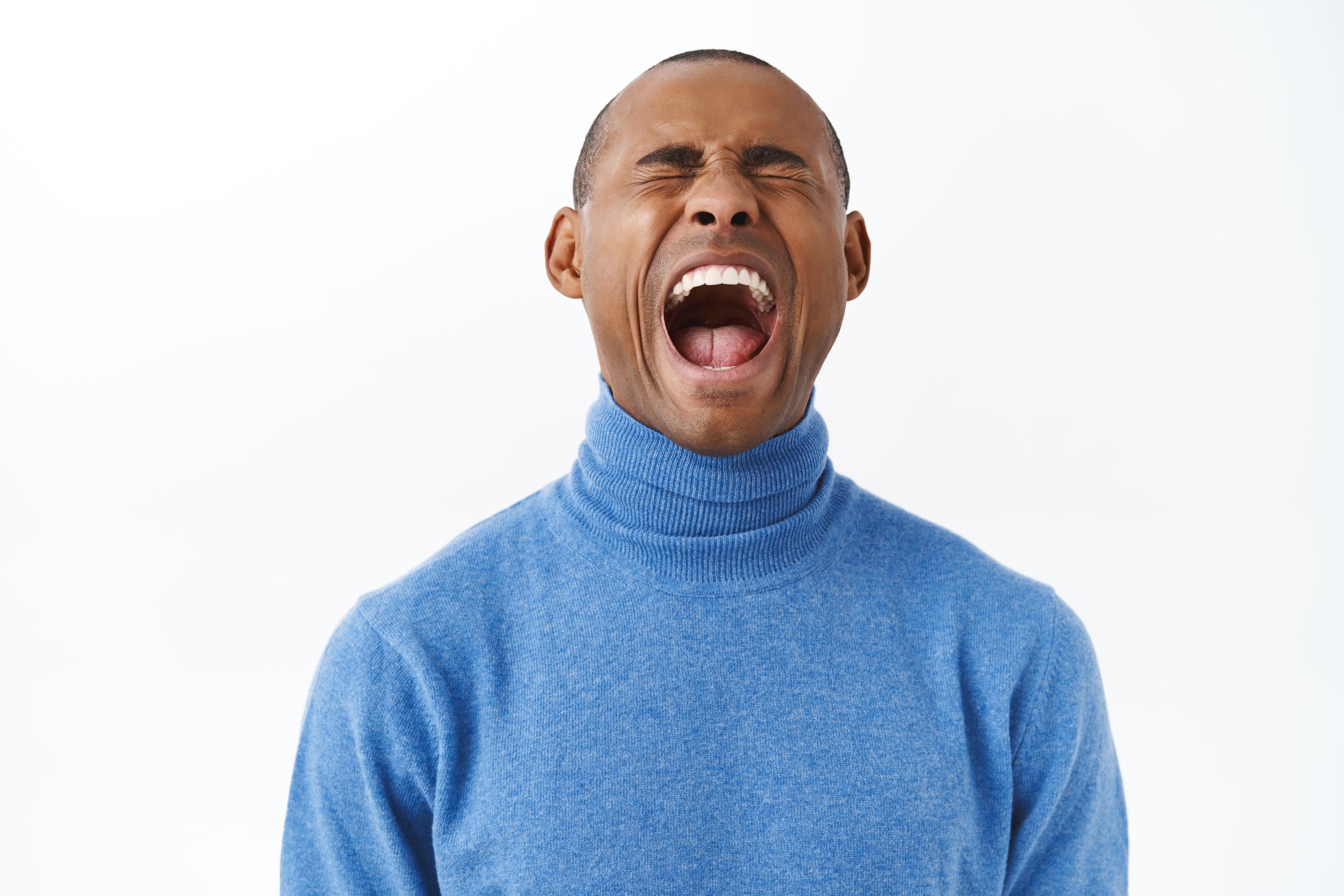 A man screaming due to workplace burnout