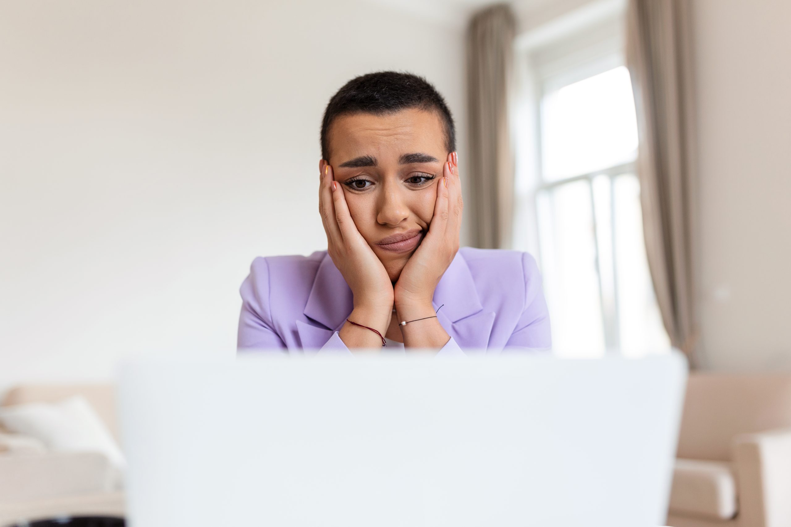 a woman feeling depressed due to burnout in the workplace