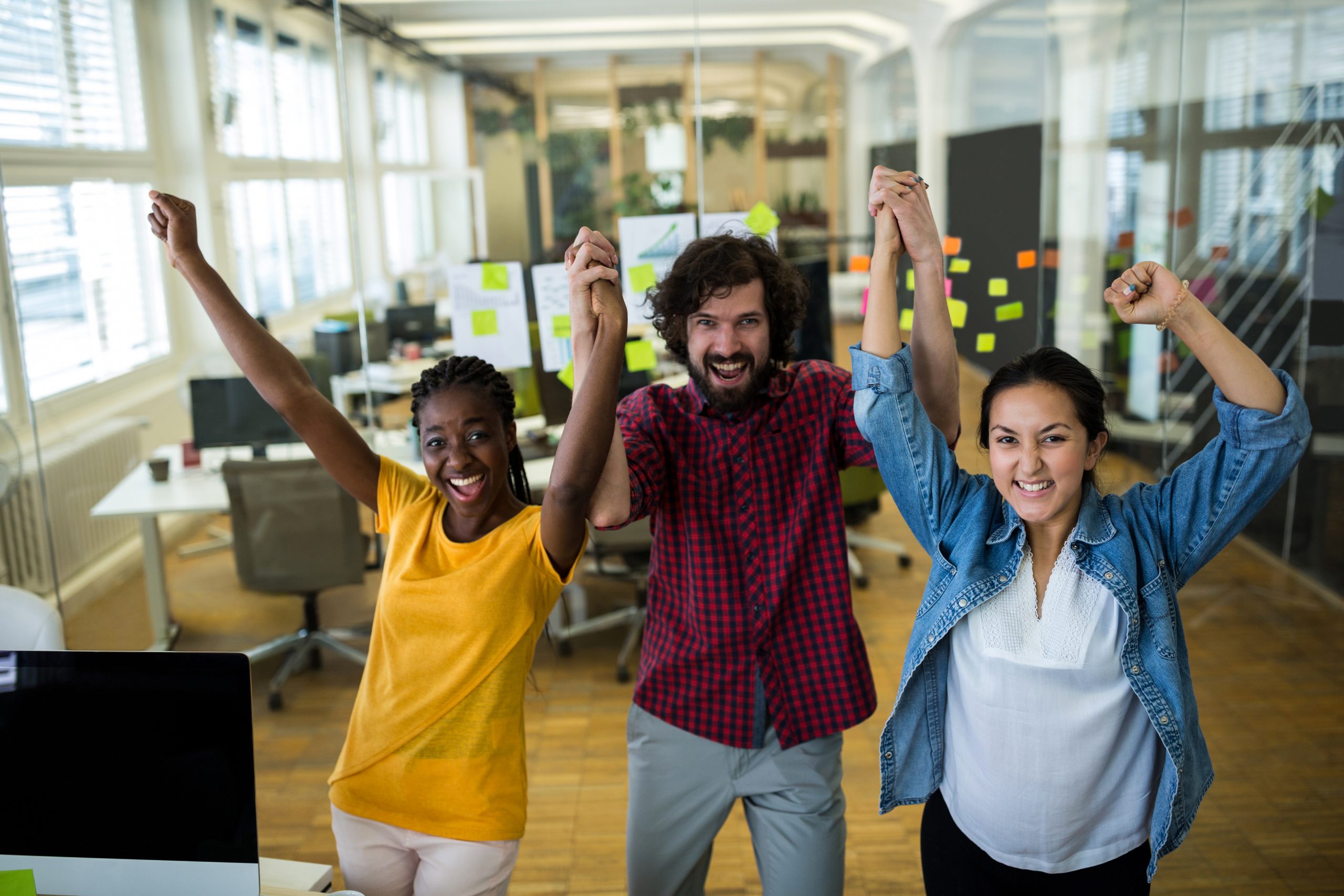 Employees cheering after resolving issues with the help of EAP