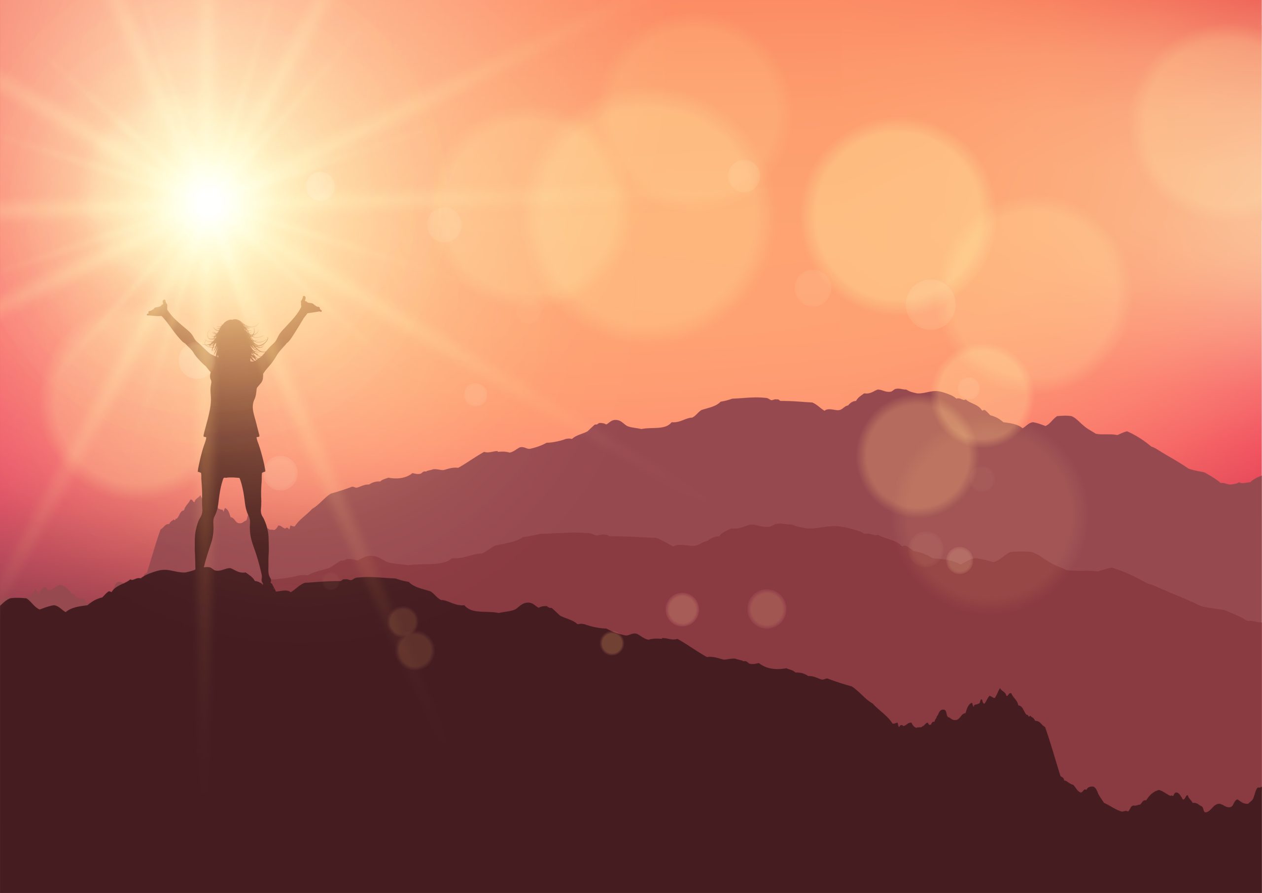 a female stood on top of a mountain against a sunset sky as a symbol of positive affirmation